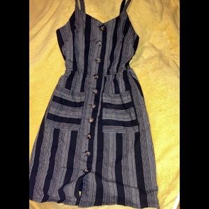 Cute black & white stripped button down style dress. Super cute for fall!